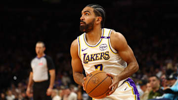 Nov 26, 2024; Phoenix, Arizona, USA; Los Angeles Lakers guard Gabe Vincent (7) against the Phoenix Suns during an NBA Cup game at Footprint Center. Mandatory Credit: Mark J. Rebilas-Imagn Images