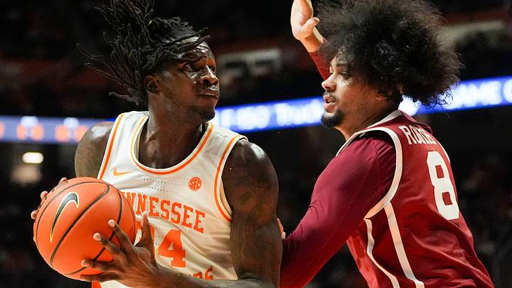 Tennessee forward Felix Okpara (34) looks for an opening while guarded by Oklahoma forward/center Kai Rogers (8) during an NCAA college basketball game on Feb. 18, 2026, in Knoxville, Tennessee.