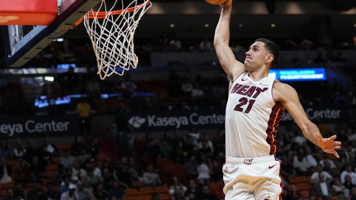 Oct 18, 2023; Miami, Florida, USA; Miami Heat forward Cole Swider (21) dunks the ball against the Brooklyn Nets during the second half at Kaseya Center. Mandatory Credit: Rich Storry-USA TODAY Sports