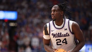 Kansas State junior forward Arthur Kaluma (24) looks for an open pass in the second half of the Sunflower Showdown inside Allen Fieldhouse Tuesday, March 5, 2024.