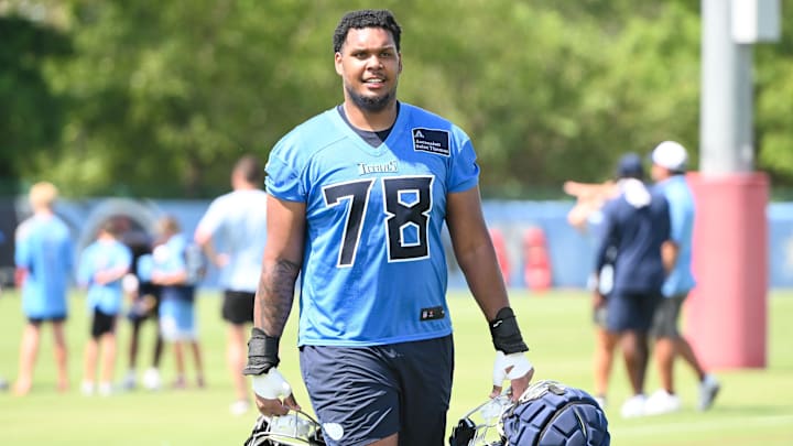 Jul 23, 2025; Nashville, TN, USA;  Tennessee Titans tackle Brandon Crenshaw-Dickson (78) is made to carry several helmets during training camp at Ascension Saint Thomas Sports Park. Mandatory Credit: Steve Roberts-Imagn Images
