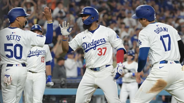 Los Angeles Dodgers left fielder Teoscar Hernandez (37) crosses the plate after hitting a three-run home run scoring designated hitter Shohei Ohtani (17) and right fielder Mookie Betts.