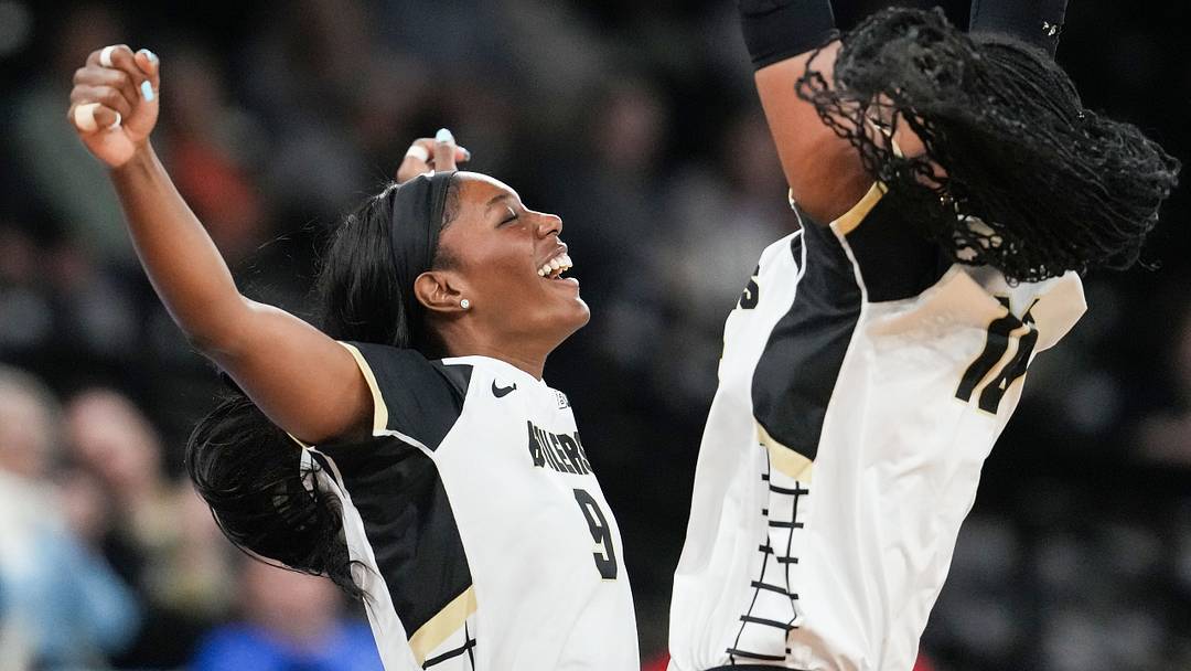 Purdue Boilermakers middle blocker Dior Charles (9) chest bumps outside hitter Mimi Mambu. Purdue Boilermakers middle blocker Dior Charles (9) chest bumps outside hitter Mimi Mambu.