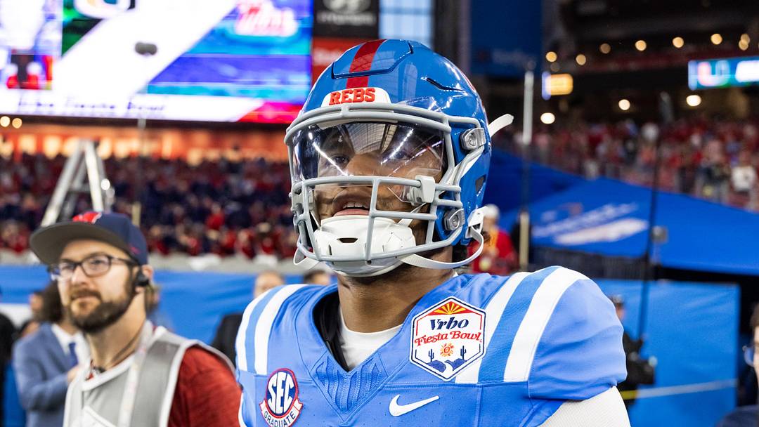 Jan 8, 2026; Glendale, AZ, USA; Mississippi Rebels quarterback Austin Simmons (13) against the Miami Hurricanes during the 2026 Fiesta Bowl and semifinal game of the College Football Playoff at State Farm Stadium. Mandatory Credit: Mark J. Rebilas-Imagn Images Jan 8, 2026; Glendale, AZ, USA; Mississippi Rebels quarterback Austin Simmons (13) against the Miami Hurricanes during the 2026 Fiesta Bowl and semifinal game of the College Football Playoff at State Farm Stadium. Mandatory Credit: Mark J. Rebilas-Imagn Images