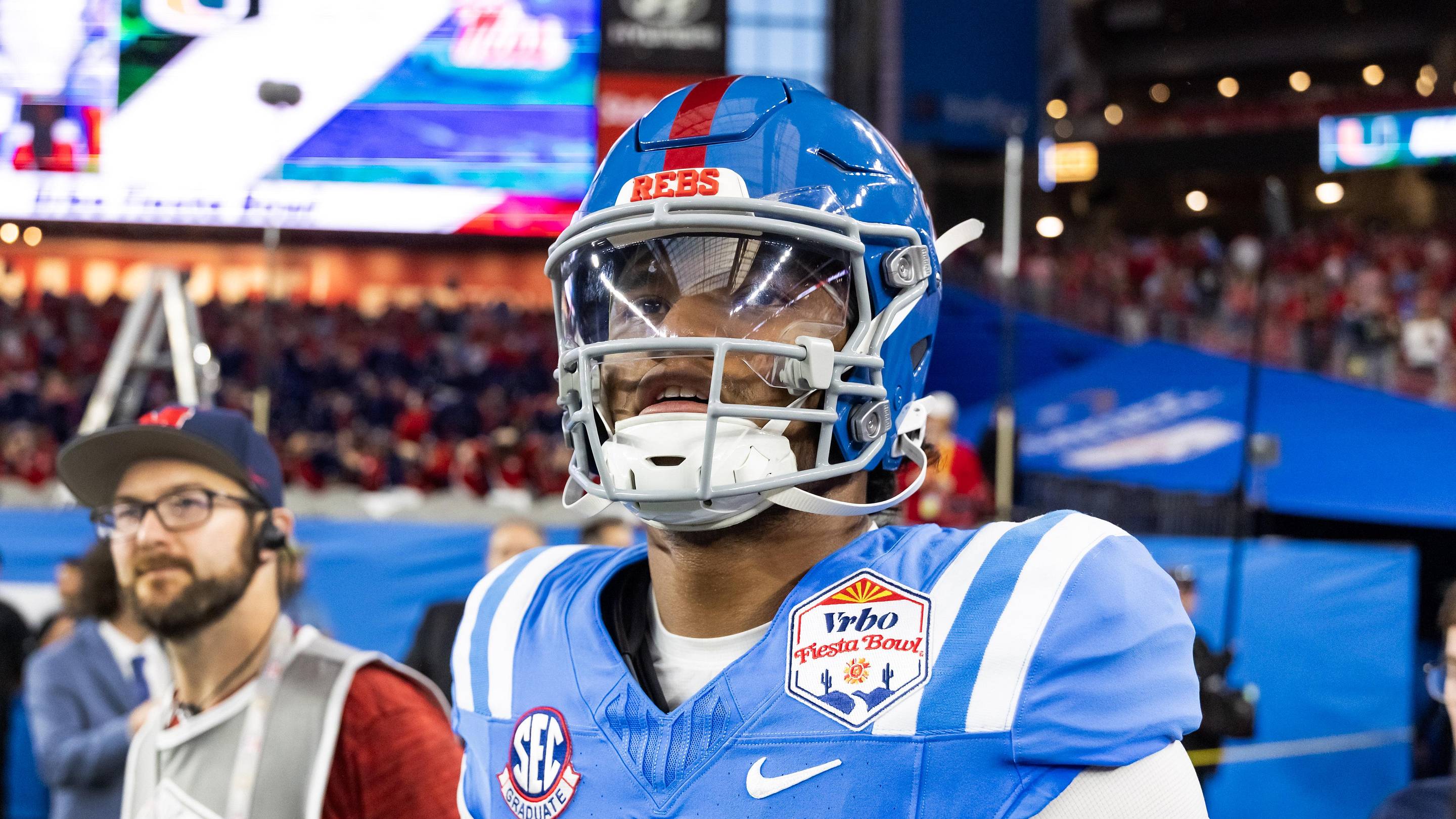 Jan 8, 2026; Glendale, AZ, USA; Mississippi Rebels quarterback Austin Simmons (13) against the Miami Hurricanes during the 2026 Fiesta Bowl and semifinal game of the College Football Playoff at State Farm Stadium. Mandatory Credit: Mark J. Rebilas-Imagn Images