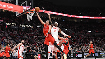 Jan 18, 2025; Portland, Oregon, USA;  Portland Trail Blazers forward Delano Banton (5) shoots over Houston Rockets guard Aaron Holiday (0) during the second half at Moda Center. Mandatory Credit: Brian Murphy-Imagn Images