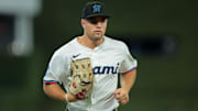 Aug 4, 2025; Miami, Florida, USA; Miami Marlins center fielder Jakob Marsee (87) returns to the dugout against the Houston Astros during the first inning at loanDepot Park. Mandatory Credit: Sam Navarro-Imagn Images