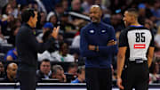 Oct 12, 2025; Orlando, Florida, USA; Miami Heat Head Coach Erik Spoelstra, Orlando Magic Head Coach Jamahl Mosley and NBA referee Robert Hussey react during a free throw during the first half at Kia Center. Mandatory Credit: Matt Pendleton-Imagn Images