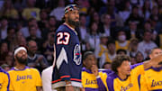 Mar 19, 2025; Los Angeles, California, USA;  Los Angeles Lakers forward LeBron James (23) looks on from the bench against the Denver Nuggets at Crypto.com Arena. Mandatory Credit: Jayne Kamin-Oncea-Imagn Images