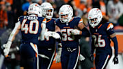 Dec 2, 2024; Denver, Colorado, USA; Denver Broncos linebacker Cody Barton (55) celebrates his interception with linebacker Justin Strnad (40) and defensive tackle Jordan Jackson (94) and safety Devon Key (26) in the fourth quarter against the Cleveland Browns at Empower Field at Mile High. 