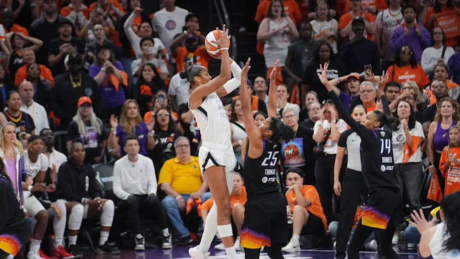 Aces center A'ja Wilson (22) makes a shot over Phoenix Mercury forward Alyssa Thomas