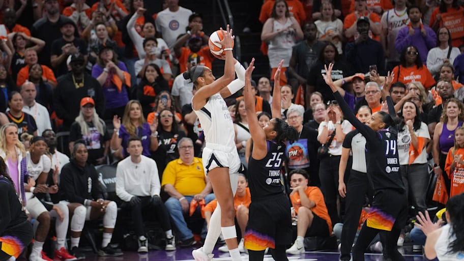 Aces center A'ja Wilson (22) makes a shot over Phoenix Mercury forward Alyssa Thomas