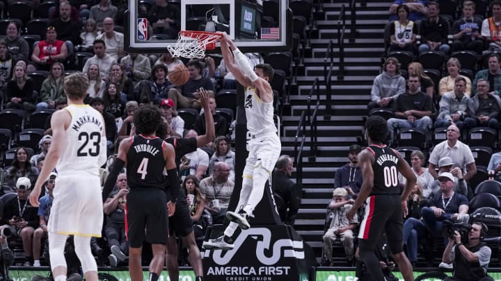 Oct 14, 2023;  Salt Lake City, Utah, USA; Utah Jazz center Walker Kessler (24) dunks against the Portland Trail Blazers in the first half at Delta Center. 