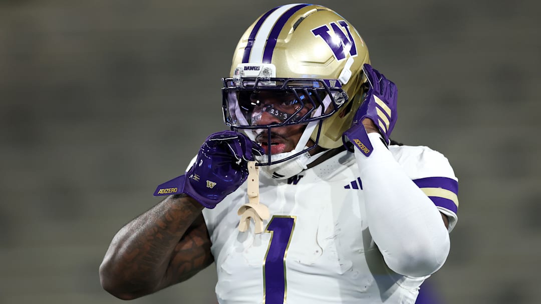 Washington running back Jonah Coleman adjusts his helmet during his Huskies' 48-14 Week 13 victory over the UCLA Bruins inside the Rose Bowl on Nov. 22, 2025.