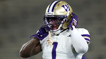 Washington running back Jonah Coleman adjusts his helmet during his Huskies' 48-14 Week 13 victory over the UCLA Bruins inside the Rose Bowl on Nov. 22, 2025.
