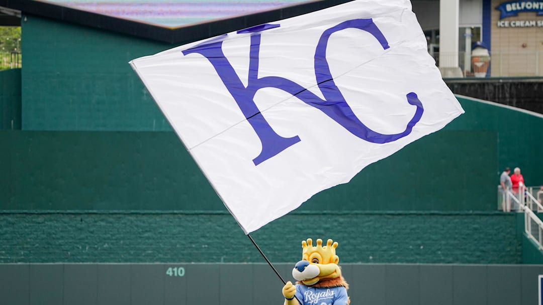May 4, 2023; Kansas City, Missouri, USA; The Kansas City Royals mascot Sluggerrr waves a large flag against the Baltimore Orioles prior to a game at Kauffman Stadium. Mandatory Credit: Denny Medley-Imagn Images