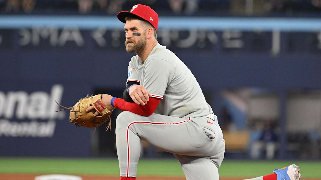 Jun 4, 2025; Toronto, Ontario, CAN;  Philadelphia Phillies first baseman Bryce Harper (3) looks on during an injury delay in the ninth inning against the Toronto Blue Jays at Rogers Centre. Dan Hamilton-Imagn Images