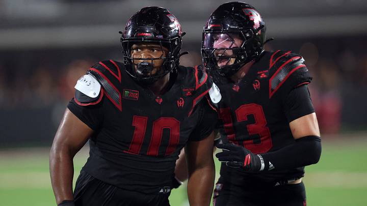 Sep 18, 2026; Lubbock, Texas, USA;  Texas Tech Red Raiders defensive tackle A.J.Holmes Jr. (10) and defensive linebacker Ben Roberts (13) watch a play in the second half against the Houston Cougars at Galaxy Stadium. Mandatory Credit: Michael C. Johnson-Imagn Images