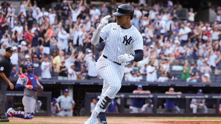 Aug 11, 2024; Bronx, New York, USA; New York Yankees right fielder Juan Soto (22) hits a solo home run during the seventh inning against the Texas Rangers at Yankee Stadium. Mandatory Credit: Vincent Carchietta-USA TODAY Sports