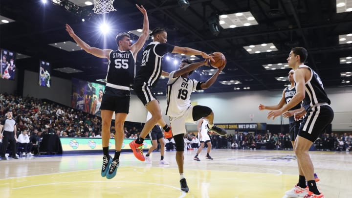 Feb 18, 2024; Indianapolis, Indiana, USA; Team ELY guard Ashton Hagans (19) of the Rip City Remix looks to play the ball defined by Team Strictly forward Cole Swider (21) of the Sioux Falls Skyforce during the G-League Next Up game at Indiana Convention Center. Mandatory Credit: Trevor Ruszkowski-USA TODAY Sports