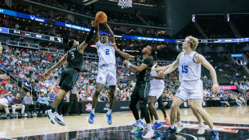 Mar 13, 2024; Kansas City, MO, USA; Brigham Young Cougars guard Jaxson Robinson (2) rebounds during their matchup against UCF in the Big 12 Tournament.