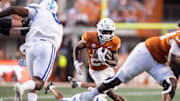 Texas Longhorns running back Quintrevion Wisner (26) runs against the Kentucky Wildcats during the third quarter at Darrell K Royal-Texas Memorial Stadium. 