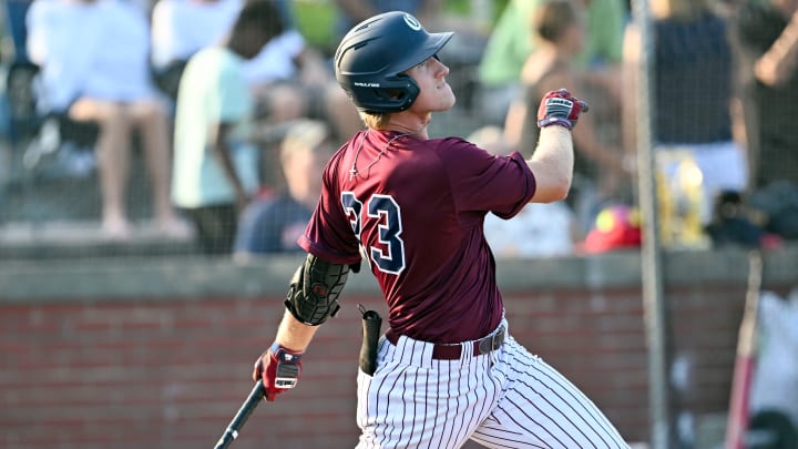 BOURNE 07/26/23   Cole Mathis of Cotuit launches a Bourne pitch for a bases loaded triple in the second inning.