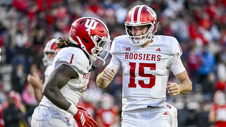 Indiana quarterback Fernando Mendoza celebrates with  running back Roman Hemby after scoring a touchdown against Maryland.