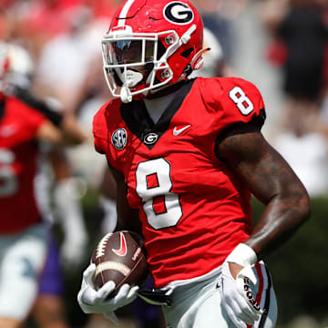 Georgia wide receiver Colbie Young (8) drives in to score a touchdown after pulling in a pass from Georgia quarterback Carson Beck (15) during the first half of a NCAA college football game against Tennessee Tech in Athens, on Saturday, Sept. 7, 2024.