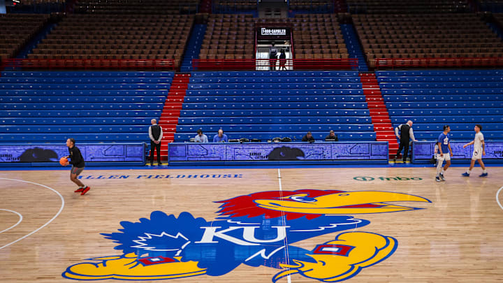 Mar 1, 2025; Lawrence, Kansas, USA; Kansas Jayhawks logo at center court prior to the game against the Texas Tech Red Raiders at Allen Fieldhouse. Mandatory Credit: William Purnell-Imagn Images