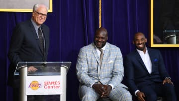 Mar 24, 2017; Los Angeles, CA, USA; Phil Jackson (left) speaks during ceremony to unveil statue of Los Angeles Lakers former center Shaquille ONeal (center) as Kobe Bryant (right) listens at Staples Center. Mandatory Credit: Kirby Lee-USA TODAY Sports