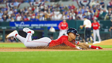 Arlington, Texas, USA; Boston Red Sox second baseman Kristian Campbell (28) slides into third base during the fourth inning against the Texas Rangers at Globe Life Field.