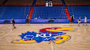Mar 1, 2025; Lawrence, Kansas, USA; Kansas Jayhawks logo at center court prior to the game against the Texas Tech Red Raiders at Allen Fieldhouse. Mandatory Credit: William Purnell-Imagn Images