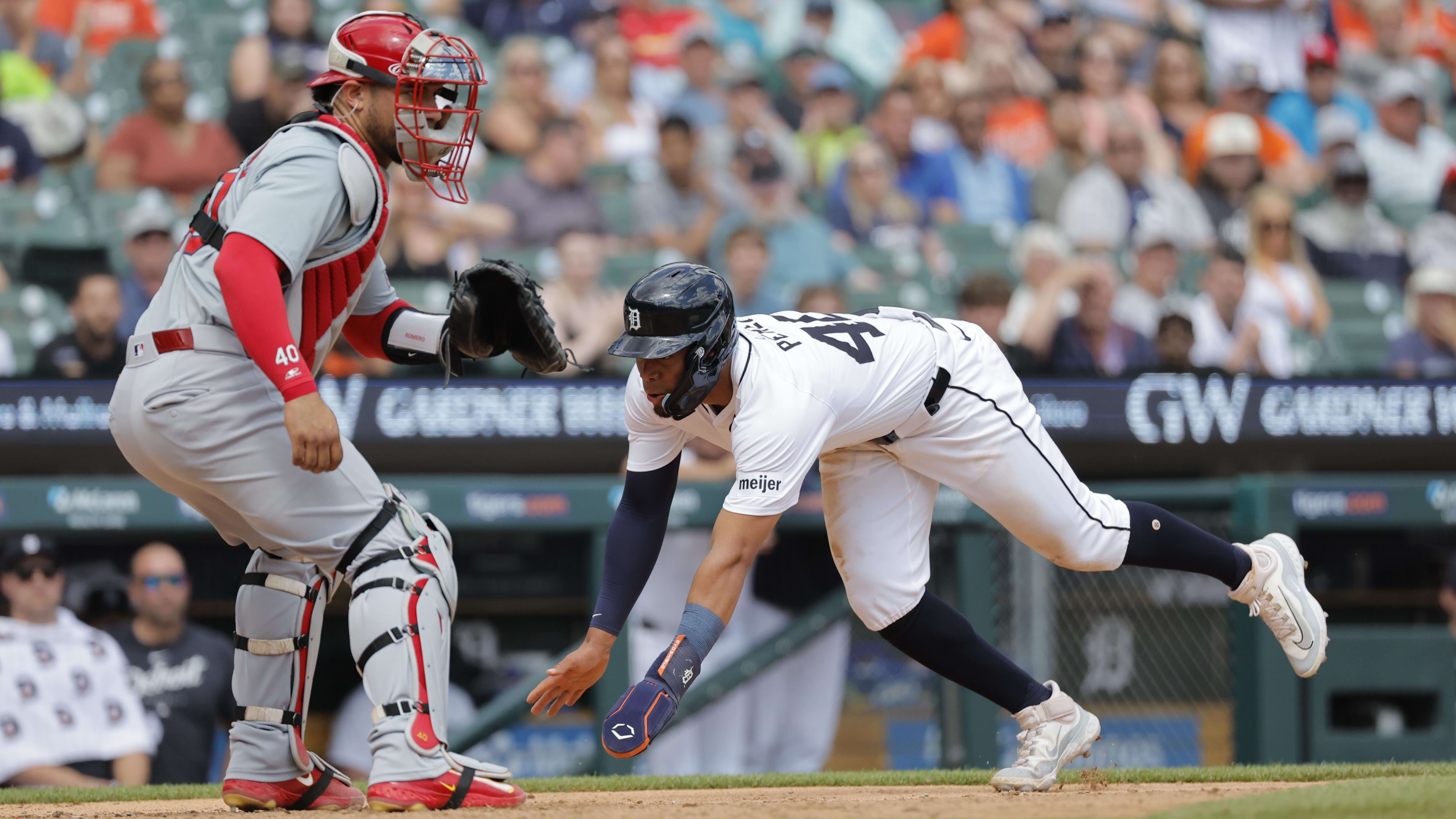 May 1, 2024; Detroit, Michigan, USA; Detroit Tigers right fielder Wenceel Perez (46) dives in safely at home plate.