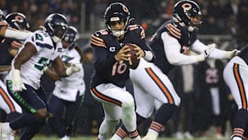 Bears quarterback Caleb Williams rolls out of the pocket against the Seattle Seahawks.
