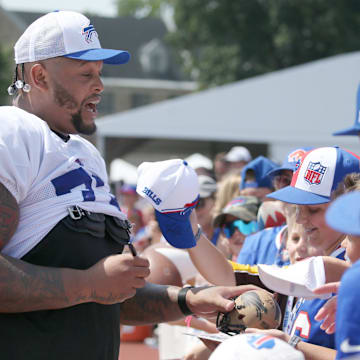 Bills offensive lineman Dion Dawkins signs autographs for fans during day five of Buffalo Bills training camp at St. John Fisher University Monday, July 28, 2025 in Pittsford, NY.