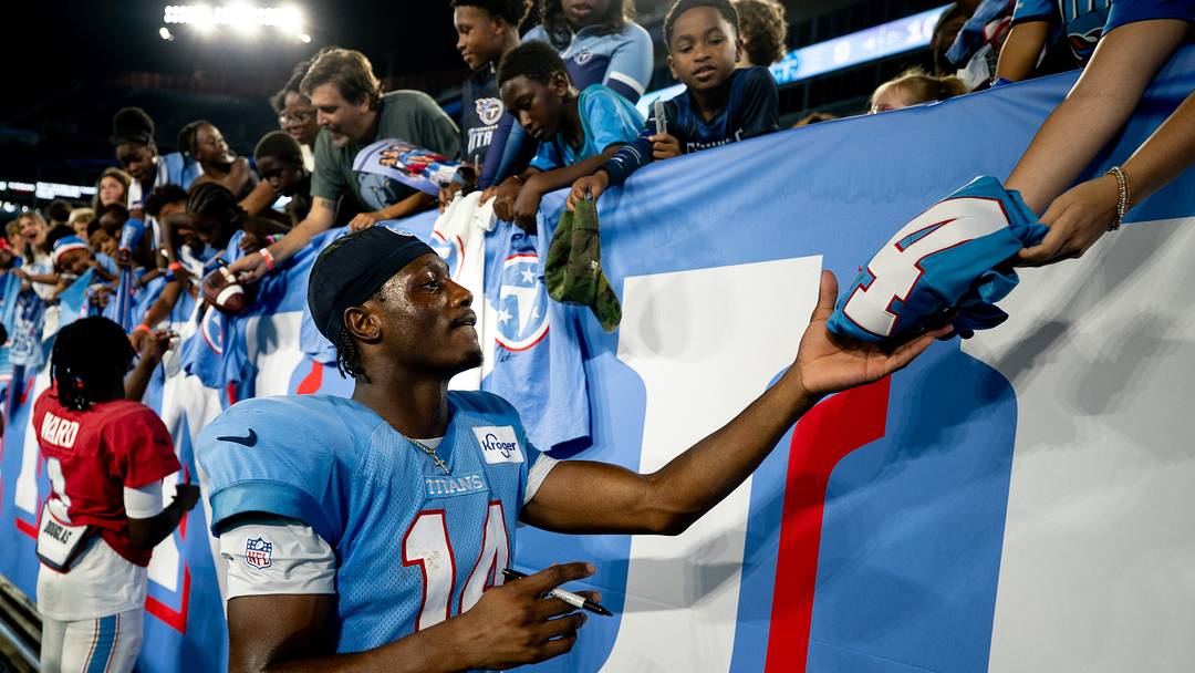 Tennessee Titans wide receiver Carnell Tate (14) signs autographs after the Blue and White Stadium Scrimmage at Nissan Stadium in Nashville, Tenn., Friday, Aug. 7, 2026. Tennessee Titans wide receiver Carnell Tate (14) signs autographs after the Blue and White Stadium Scrimmage at Nissan Stadium in Nashville, Tenn., Friday, Aug. 7, 2026.