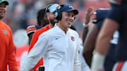 Nov 22, 2025; Auburn, Alabama, USA;  Auburn Tigers interim head coach DJ Durkin greets his team after a touchdown in the fourth quarter against the Mercer Bears at Jordan-Hare Stadium.
