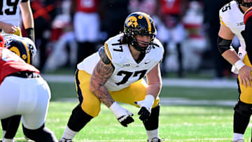 Iowa Hawkeyes offensive lineman Connor Colby (77)