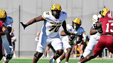Oct 12, 2024; Amherst, Massachusetts, USA; Missouri Tigers offensive lineman Cayden Green (70) in action during the second half against the Massachusetts Minutemen at Warren McGuirk Alumni Stadium. Mandatory Credit: Eric Canha-Imagn Images