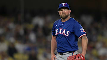 Jun 13, 2024; Los Angeles, California, USA;  Texas Rangers relief pitcher Kirby Yates (39) reacts after the final out of the ninth inning to earn a save against the Los Angeles Dodgers at Dodger Stadium.