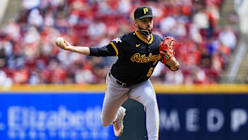 Apr 13, 2025; Cincinnati, Ohio, USA; Pittsburgh Pirates relief pitcher Justin Lawrence (61) pitches against the Cincinnati Reds in the sixth inning at Great American Ball Park. Mandatory Credit: Katie Stratman-Imagn Images