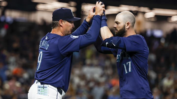 Seattle Mariners right fielder Mitch Haniger (right) celebrates with manager Scott Servais after hitting a walk-off double against the Detroit Tigers on Aug. 8 at T-Mobile Park.