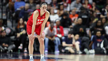 Clark looks on during the first half against the Connecticut Sun.