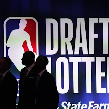 May 16, 2023; Chicago, IL, USA; People walk past the 2023 NBA Draft Lottery board at McCormick Place West. Mandatory Credit: David Banks-Imagn Images