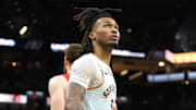 Apr 13, 2025; San Antonio, Texas, USA; San Antonio Spurs guard Stephon Castle (5) looks to the scoreboard during the second half against the Toronto Raptors at Frost Bank Center.