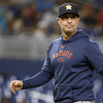 Aug 6, 2025; Miami, Florida, USA;  Houston Astros manager Joe Espada (19) walks back from the pitcher's mound against the Miami Marlins during the fourth inning at loanDepot Park.