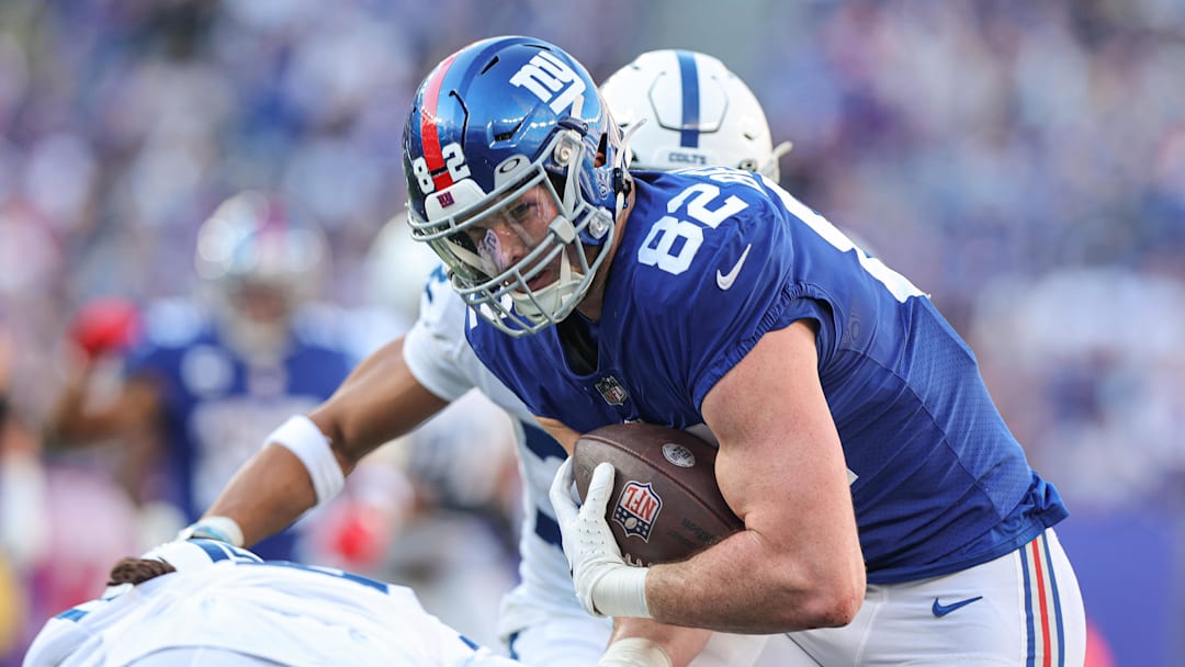 Jan 1, 2023; East Rutherford, New Jersey, USA; New York Giants tight end Daniel Bellinger (82) fights for yards after the catch against the Indianapolis Colts during the first half at MetLife Stadium. Mandatory Credit: Vincent Carchietta-Imagn Images Jan 1, 2023; East Rutherford, New Jersey, USA; New York Giants tight end Daniel Bellinger (82) fights for yards after the catch against the Indianapolis Colts during the first half at MetLife Stadium. Mandatory Credit: Vincent Carchietta-Imagn Images