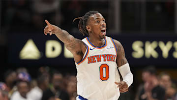 Apr 5, 2025; Atlanta, Georgia, USA; New York Knicks guard Delon Wright (0) reacts after making a three point shot against the Atlanta Hawks during the second half at State Farm Arena. Mandatory Credit: Dale Zanine-Imagn Images