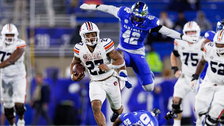 Oct 26, 2024; Lexington, Kentucky, USA; Auburn Tigers running back Jarquez Hunter (27) runs the ball during the fourth quarter against the Kentucky Wildcats at Kroger Field. Mandatory Credit: Jordan Prather-Imagn Images